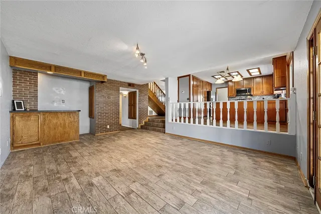 an aerial view of a residential apartment building with a yard