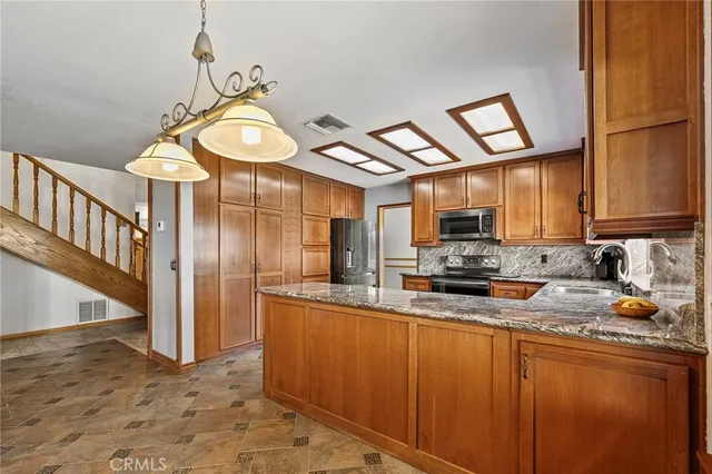 an aerial view of a house with a garden and plants