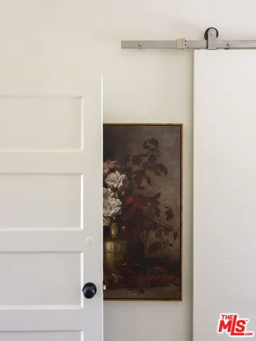 a bathroom with a shower and a sink