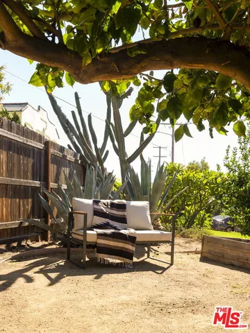 a view of outdoor space with lots of swings and slides