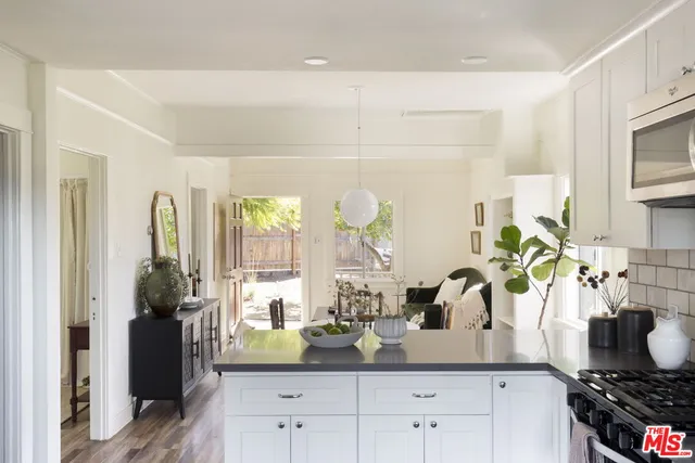 a kitchen with sink and stove