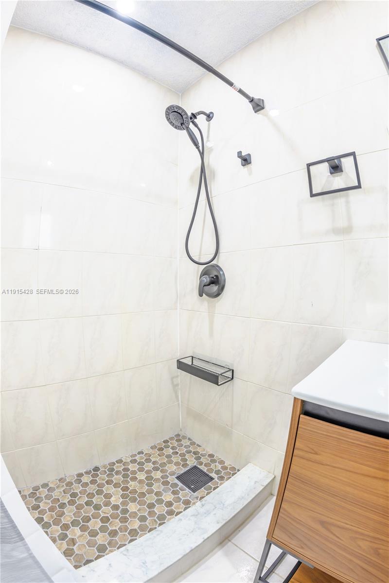 314 Southeast 3rd Street Dania Beach, FL 33004 - Photo 16 of 26 a bathroom with a shower
