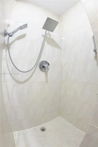 a bed room with a bed and a night stand