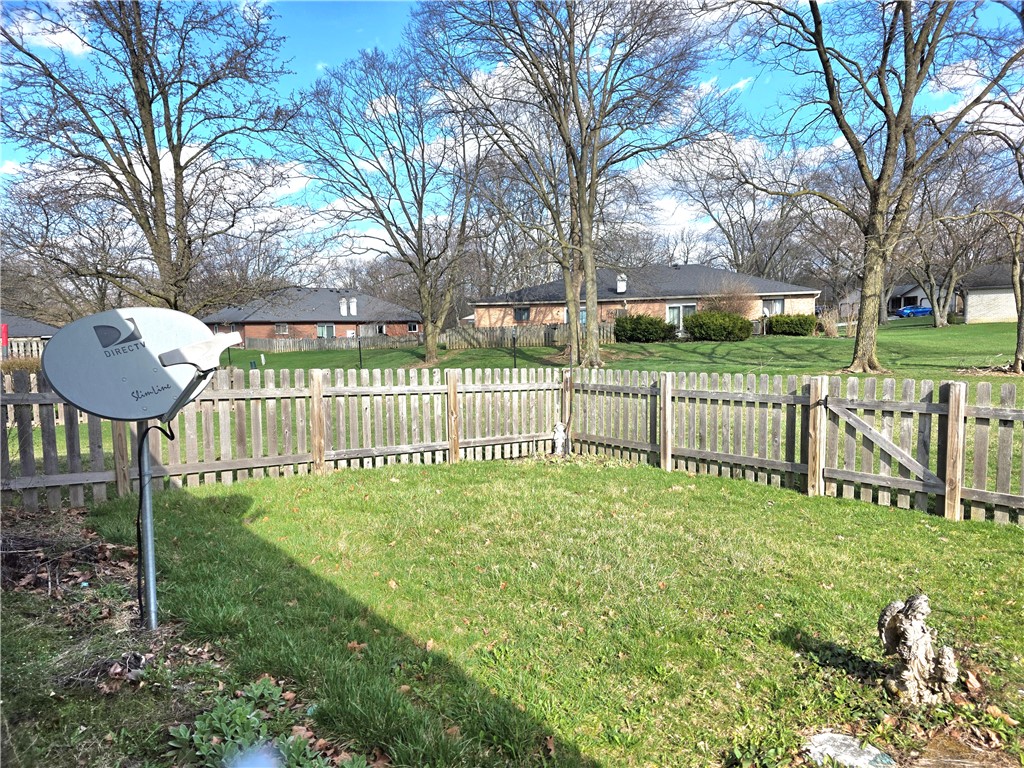 9920 Sheehan Road Dayton, OH 45458 - Photo 39 of 46 This yard offers a fenced perimeter and a clear view of the neighborhood.