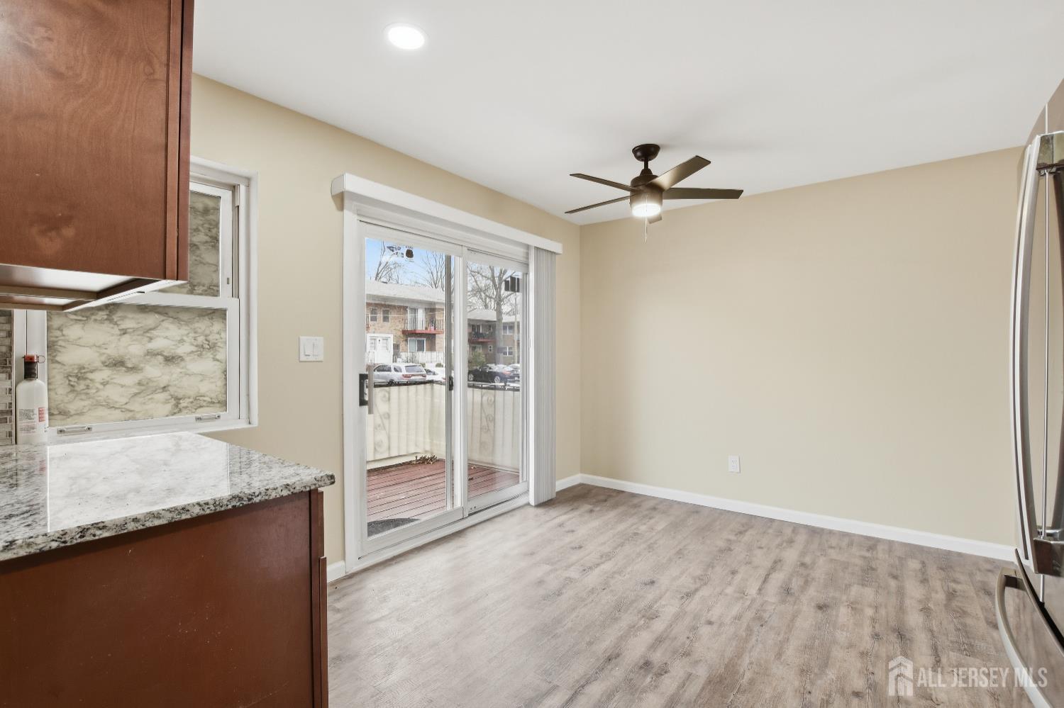 160 Evergreen Road, Unit 14A Edison, NJ 08837 - Photo 13 of 15 wooden floor in an empty room with a window