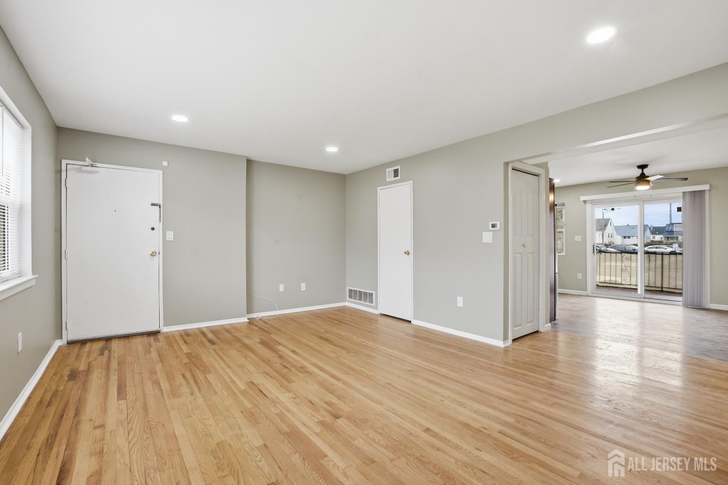 160 Evergreen Road, Unit 14A Edison, NJ 08837 - Photo 8 of 15 a view of a big room with wooden floor and windows