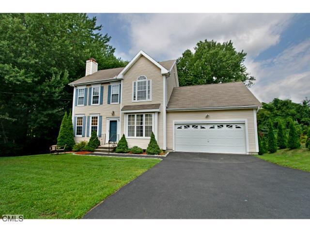 60 Timber Ridge Road Stratford, CT 06614 - Photo 1 of 1 a front view of a house with a yard and garage