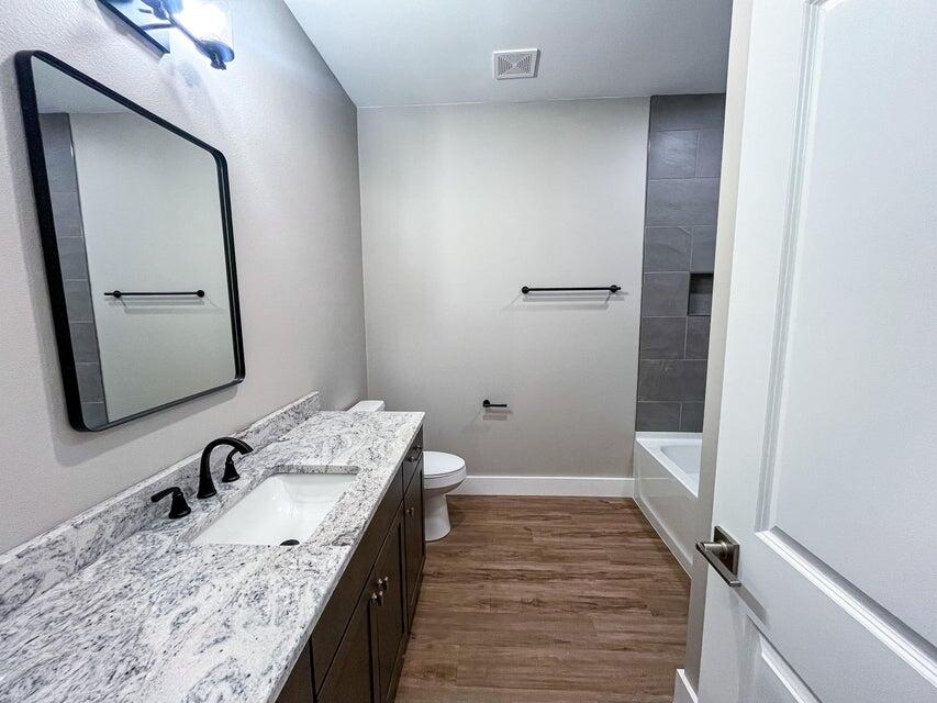 2879 Leahs Lane Navarre, FL 32566 - Photo 9 of 13 a bathroom with a granite countertop sink and a mirror