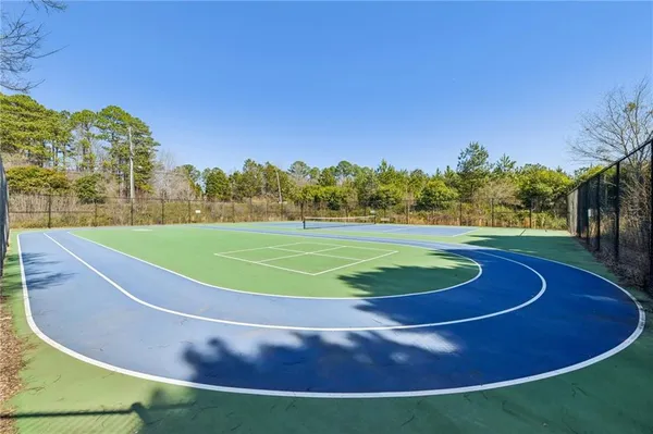 a view of a swimming pool with a yard