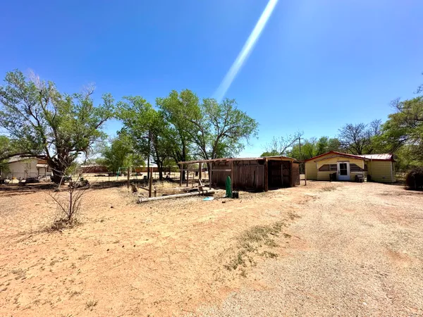 a swimming pool with outdoor seating and yard