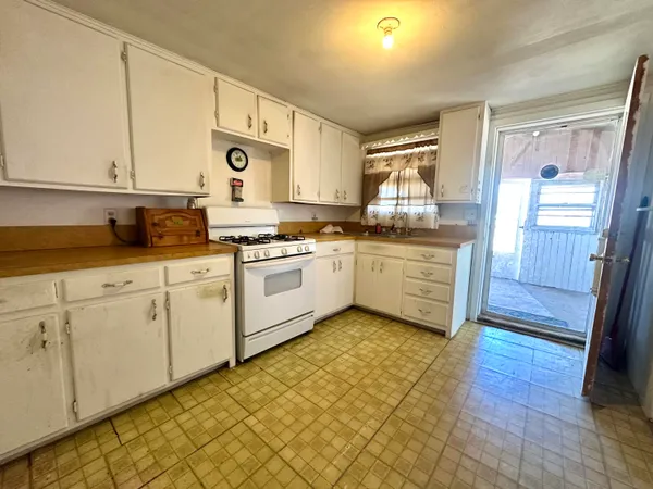a kitchen with stainless steel appliances granite countertop a sink and cabinets
