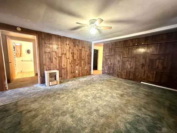 a view of an empty room with a fireplace