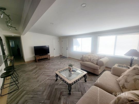 1512 South Mahan Street Ridgecrest, CA 93555 - Photo 3 of 16 a living room with furniture and a flat screen tv