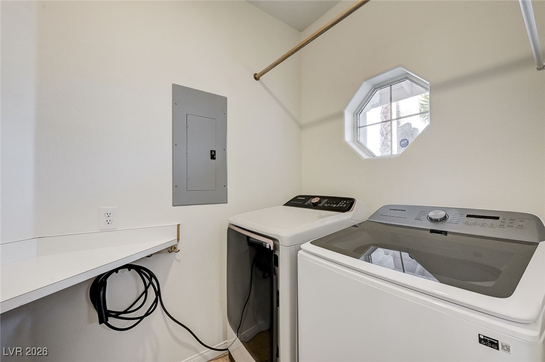 2955 El Camino Road Las Vegas, NV 89146 - Photo 31 of 99 Laundry area with electric panel and washer and dryer