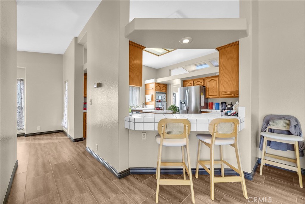 21720 Yucca Road Perris, CA 92570 - Photo 13 of 58 a dining room with furniture and wooden floor