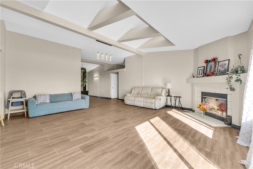 21720 Yucca Road Perris, CA 92570 - Photo 14 of 58 a spacious bedroom with furniture and a fireplace