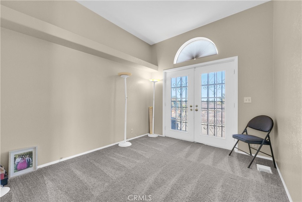 21720 Yucca Road Perris, CA 92570 - Photo 19 of 58 a view of an empty room and window and wooden floor