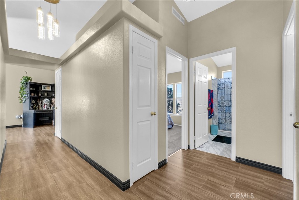 21720 Yucca Road Perris, CA 92570 - Photo 20 of 58 a view of a hallway with wooden floor and closet