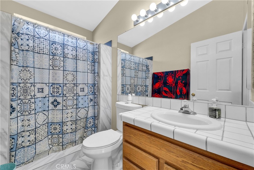21720 Yucca Road Perris, CA 92570 - Photo 22 of 58 a bathroom with a sink toilet and shower