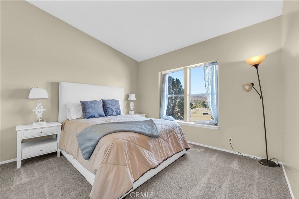 21720 Yucca Road Perris, CA 92570 - Photo 23 of 58 a bedroom with a bed and a window