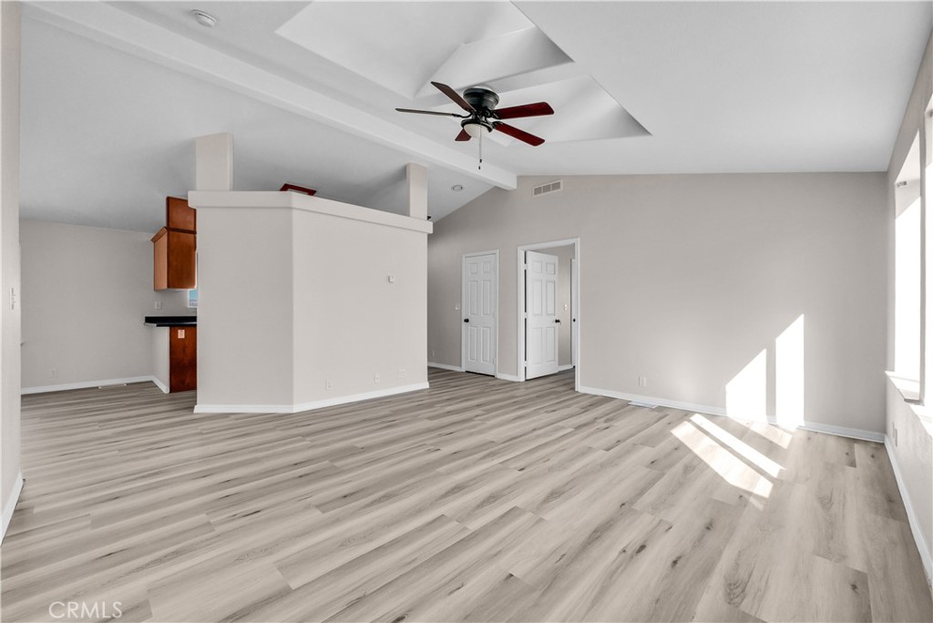 21720 Yucca Road Perris, CA 92570 - Photo 28 of 58 a view of empty room with wooden floor and ceiling fan