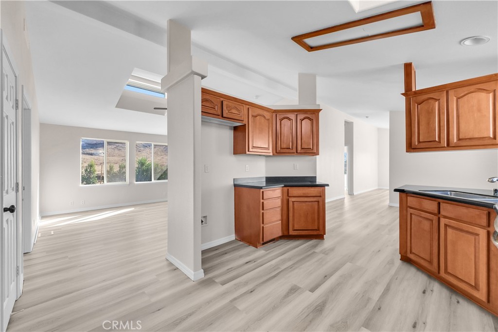 21720 Yucca Road Perris, CA 92570 - Photo 31 of 58 a view of kitchen with wooden floor and electronic appliances