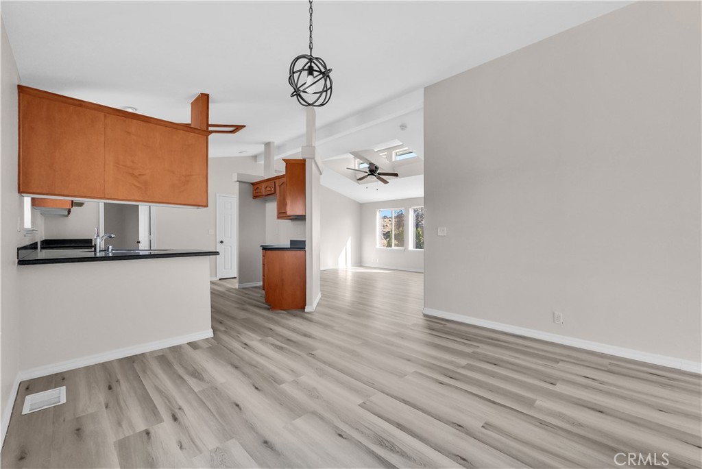 21720 Yucca Road Perris, CA 92570 - Photo 32 of 58 a view of a room with wooden floor and a window