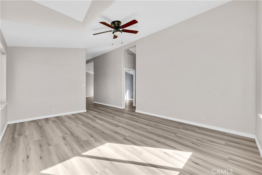 21720 Yucca Road Perris, CA 92570 - Photo 33 of 58 a view of empty room with wooden floor and fan