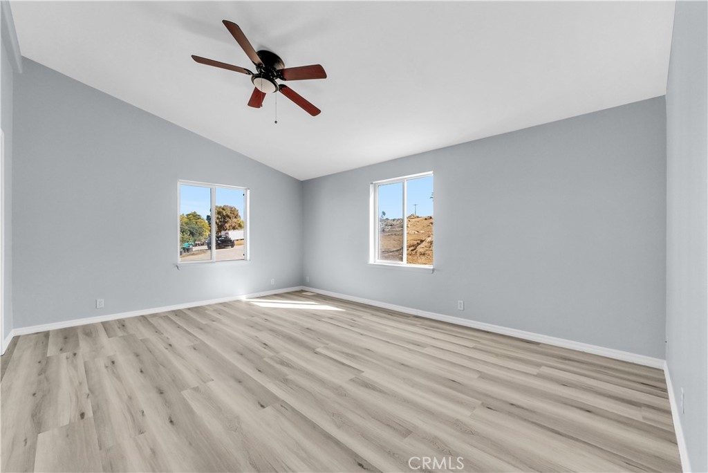 21720 Yucca Road Perris, CA 92570 - Photo 38 of 58 wooden floor in an empty room with a window