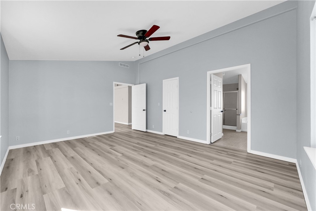 21720 Yucca Road Perris, CA 92570 - Photo 39 of 58 a view of empty room with wooden floor and fan
