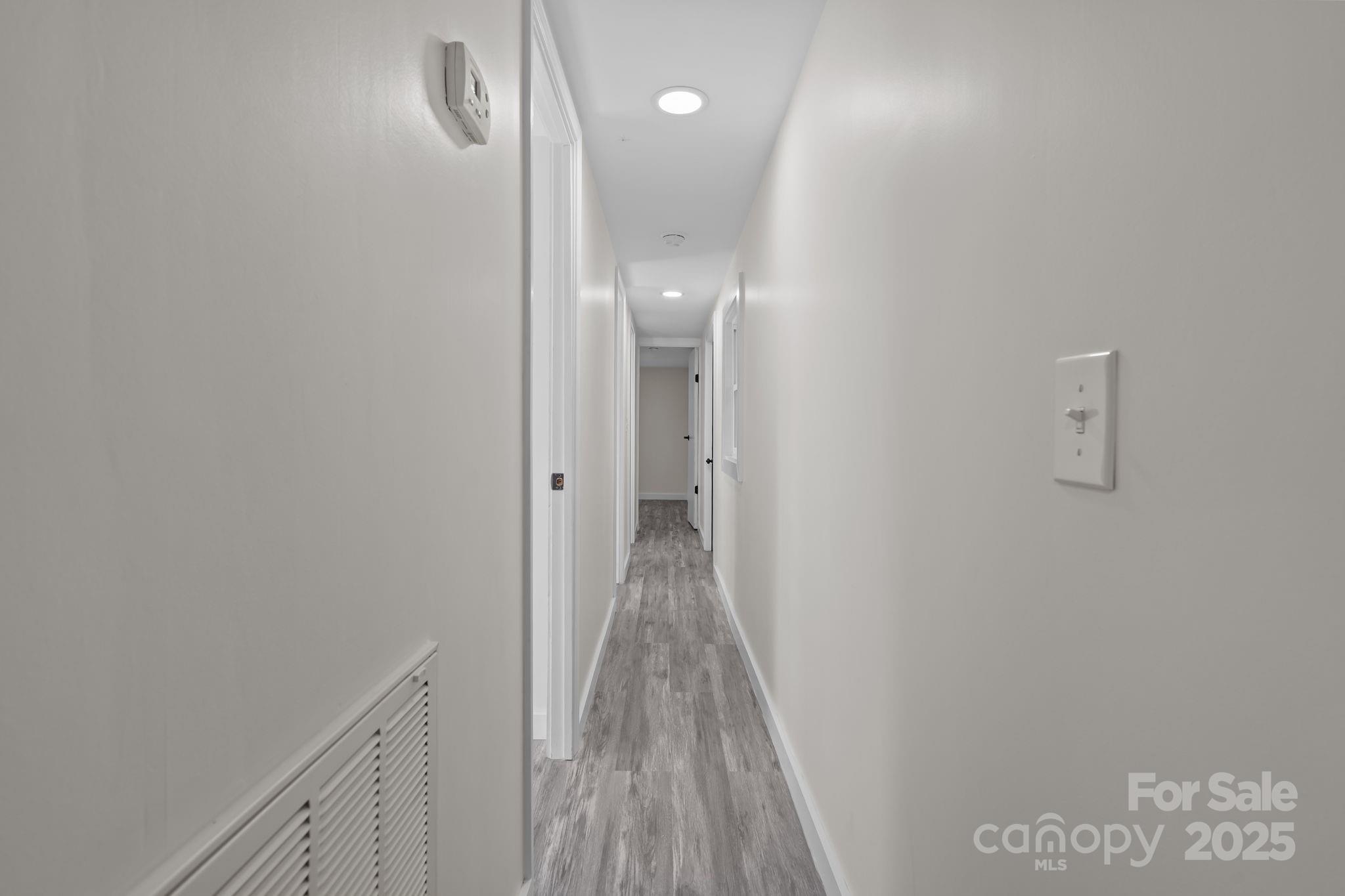 2627 McCallum Road Candor, NC 27229 - Photo 21 of 41 a view of a hallway with wooden floor