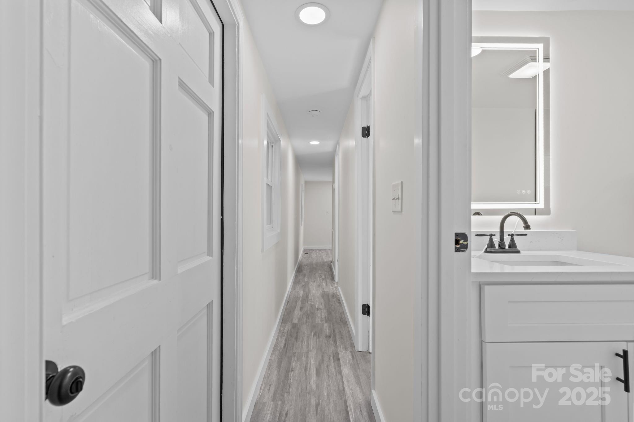 2627 McCallum Road Candor, NC 27229 - Photo 27 of 41 a bathroom with a sink and mirror