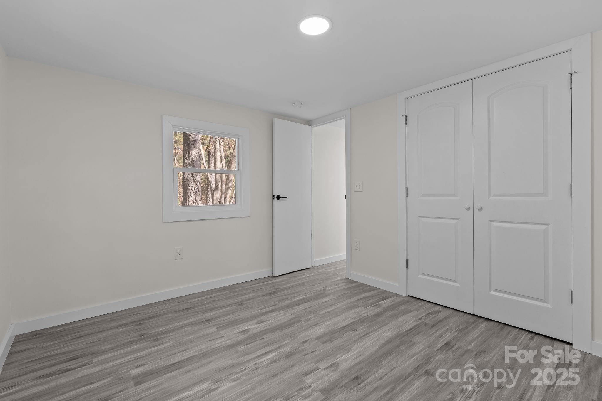 2627 McCallum Road Candor, NC 27229 - Photo 31 of 41 a view of an empty room with wooden floor