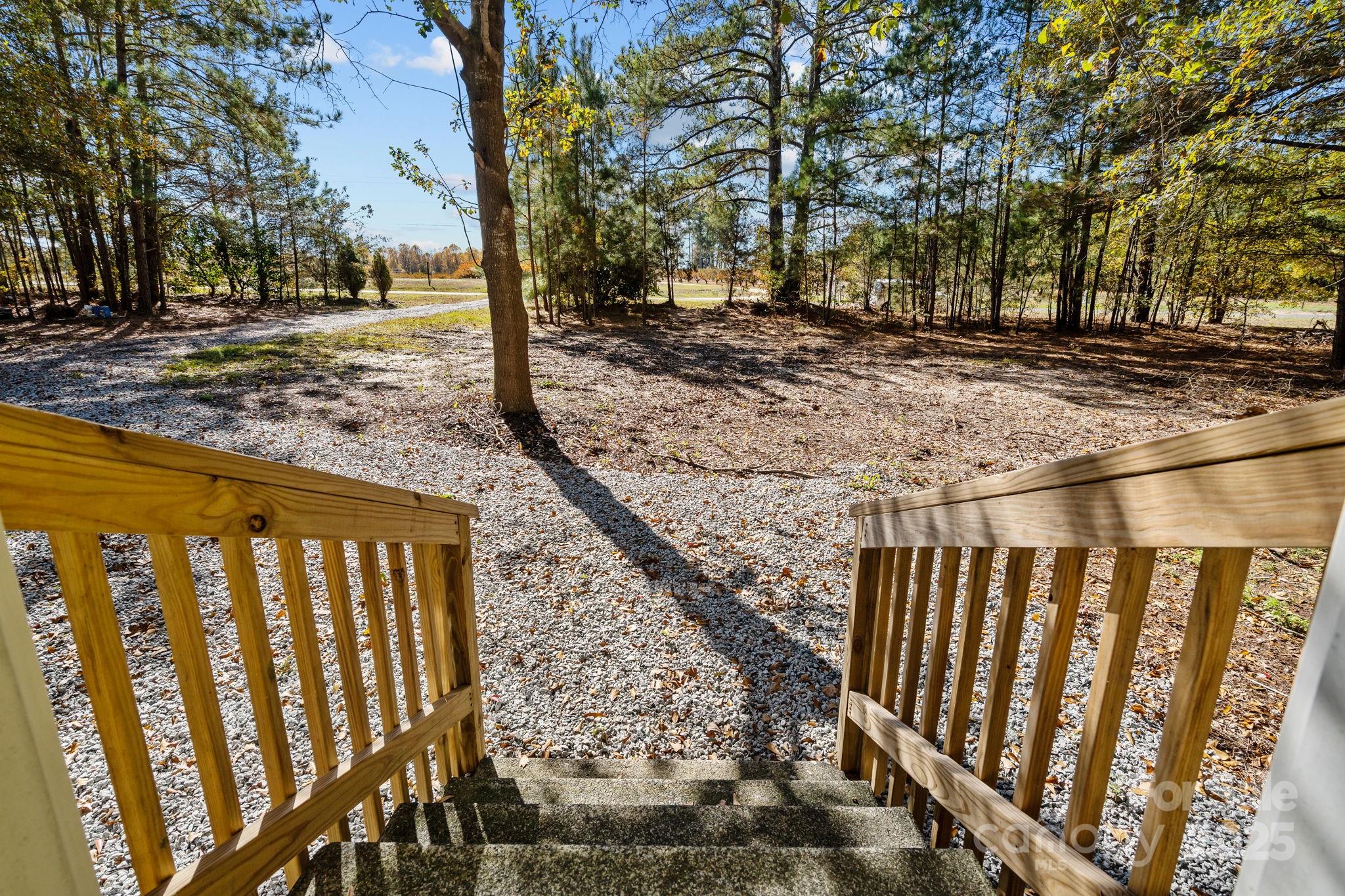 2627 McCallum Road Candor, NC 27229 - Photo 34 of 41 a view of a pathway of a yard with wooden fence