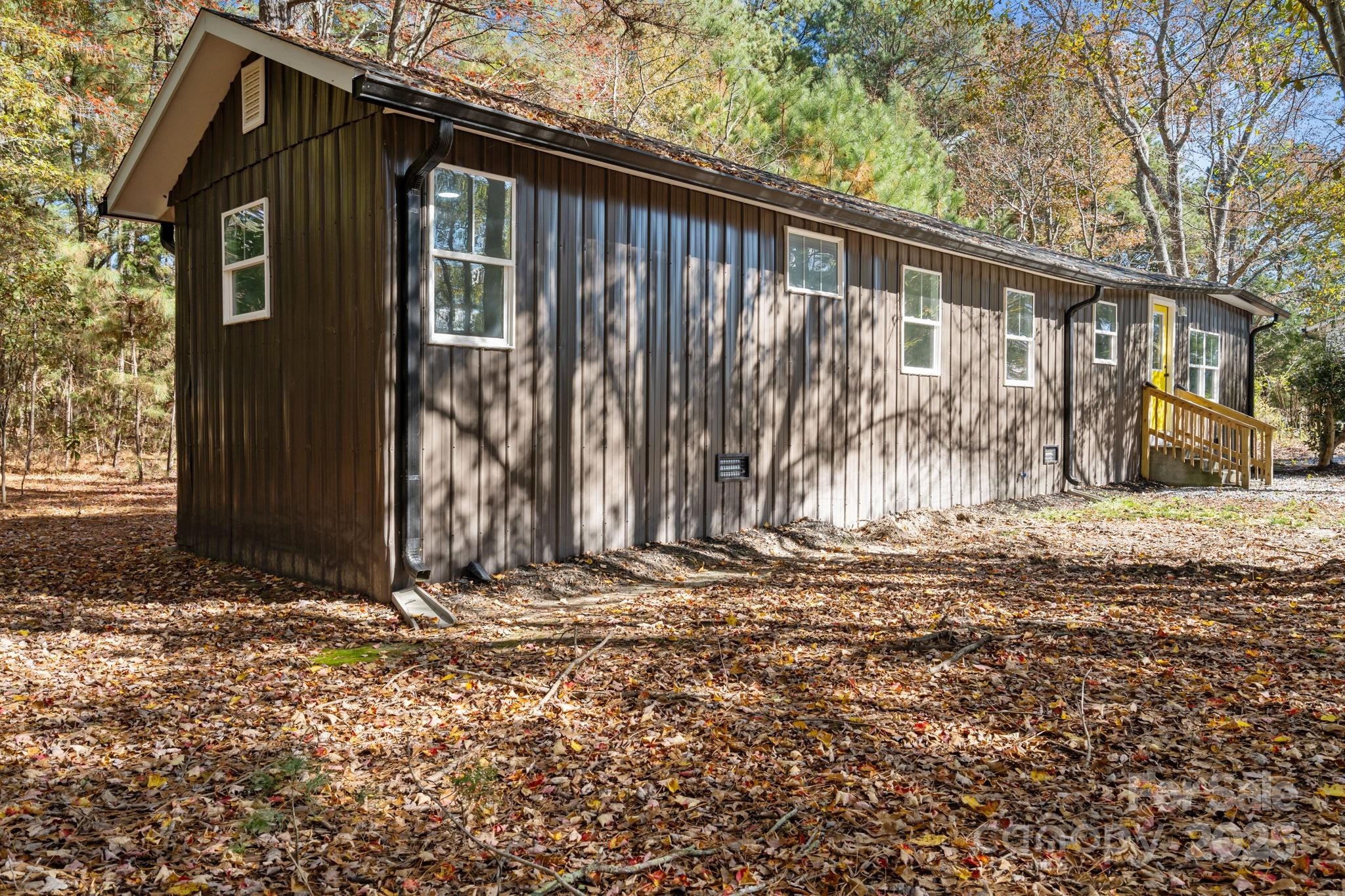 2627 McCallum Road Candor, NC 27229 - Photo 35 of 41 a view of wooden house with large windows