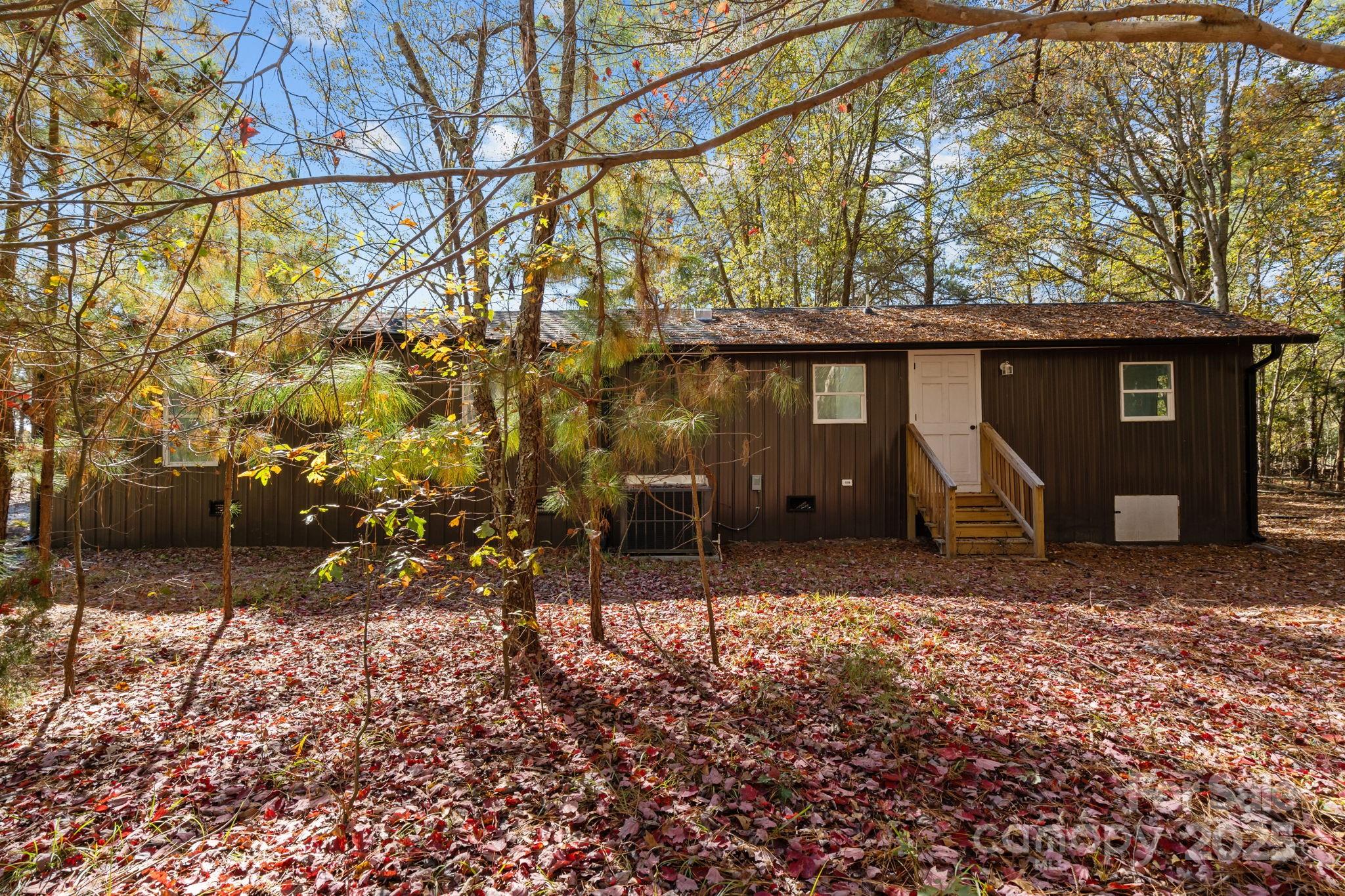 2627 McCallum Road Candor, NC 27229 - Photo 37 of 41 a view of a house with a yard