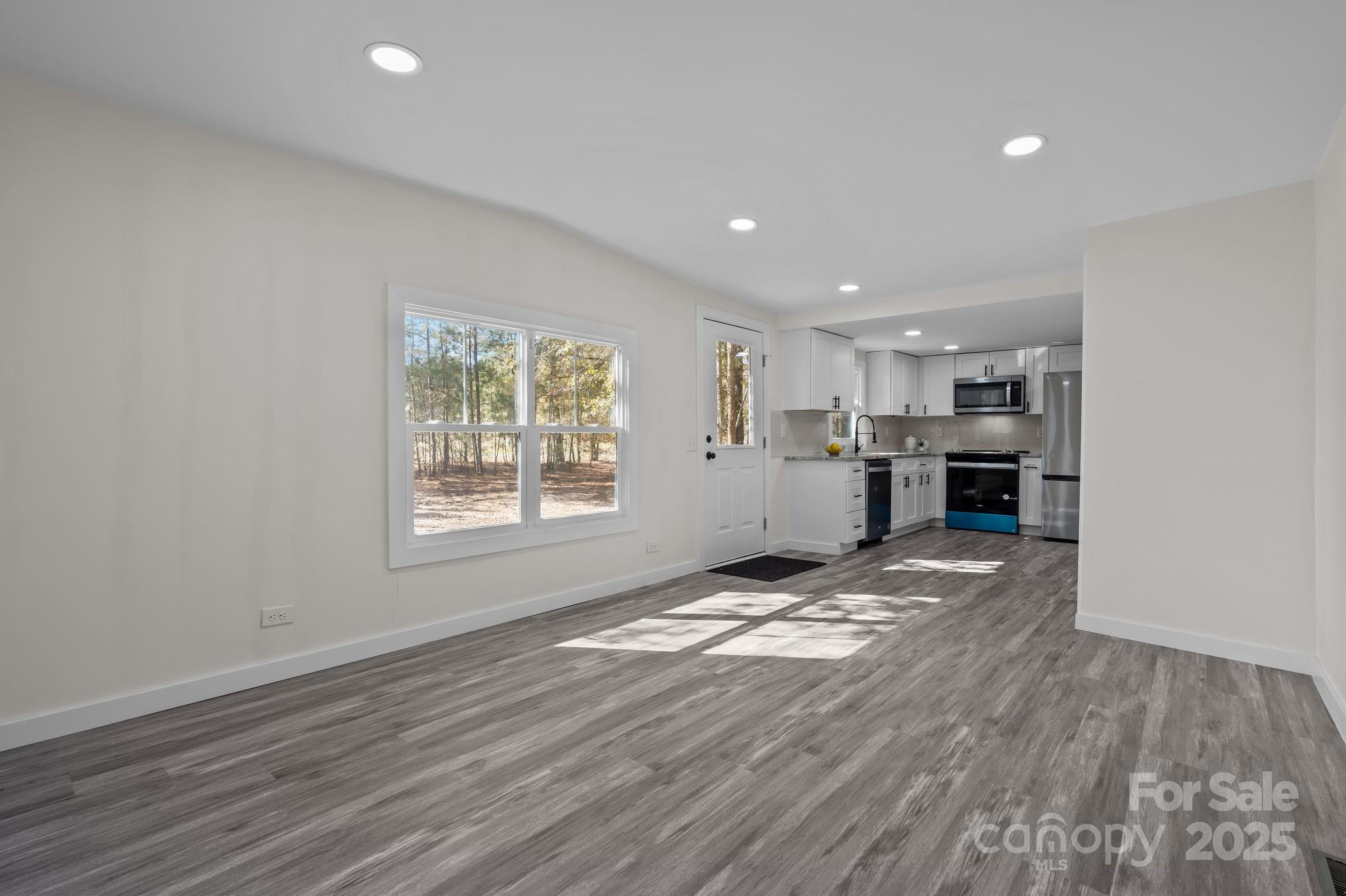 2627 McCallum Road Candor, NC 27229 - Photo 9 of 41 a view of kitchen and refrigerator