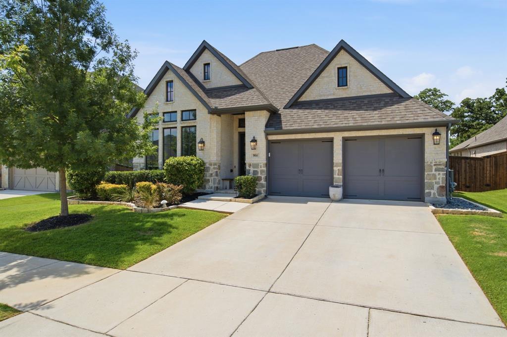 904 Fallbrook Avenue Denton, TX 76210 - Photo 1 of 30 a front view of a house with garden