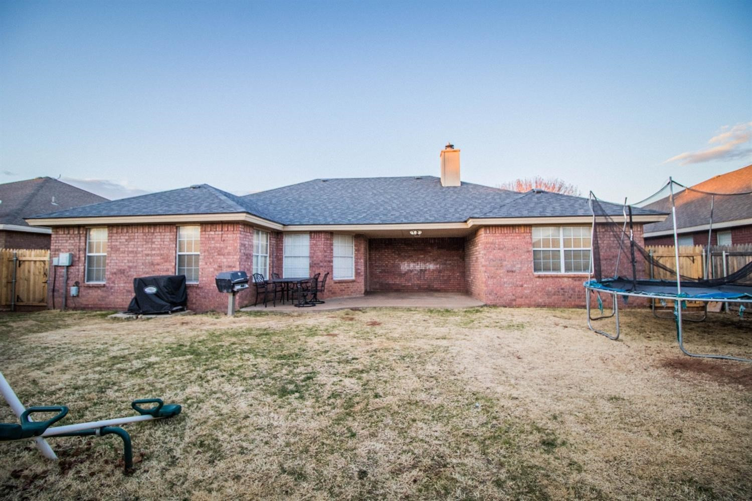 5821 89th Street Lubbock, TX 79424 - Photo 19 of 19 a view of a house with a yard and sitting area