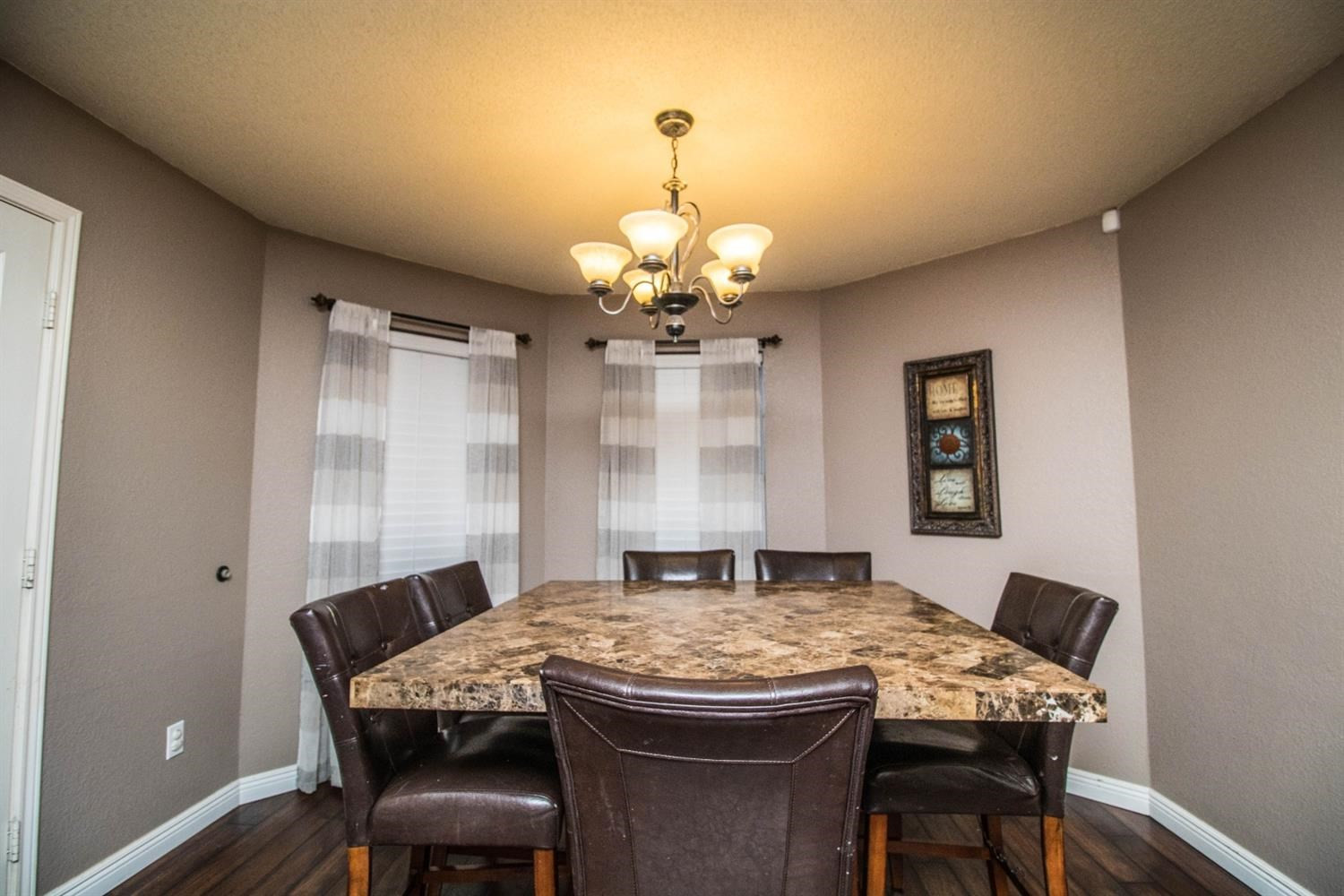 5821 89th Street Lubbock, TX 79424 - Photo 6 of 19 a view of a dining room with a table and chairs