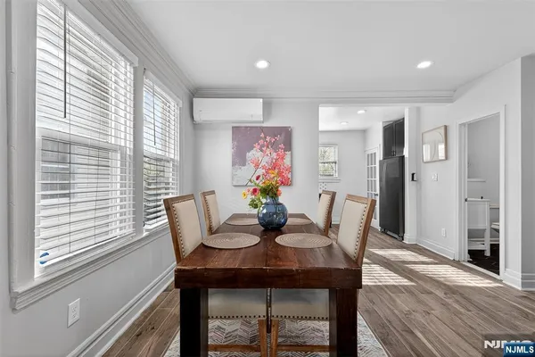a view of a dining room with furniture wooden floor and a window