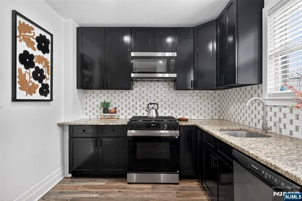 a kitchen with a sink and a stove