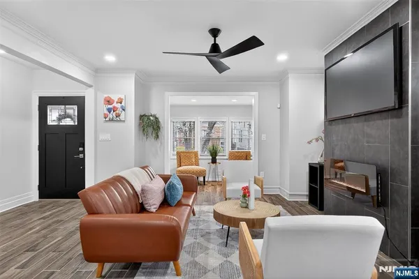 a living room with furniture and a flat screen tv