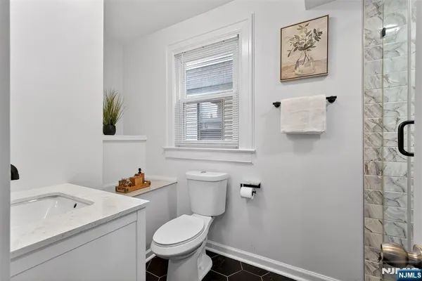 a bathroom with a sink toilet and vanity