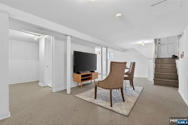 a view of a livingroom with furniture and lounge chair