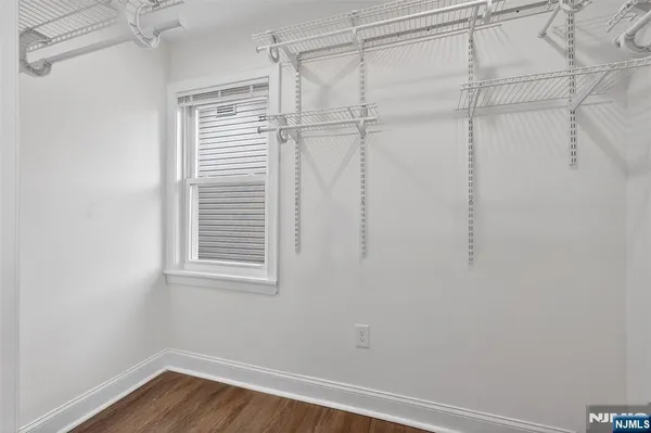 a view of a small space with racks on the wall