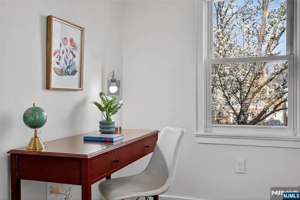 a view of a workspace with furniture