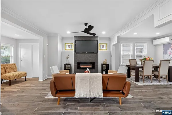a living room with furniture and a fireplace