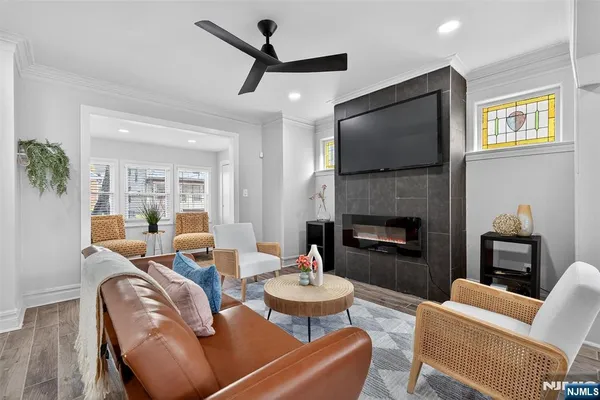 a living room with furniture fireplace and a flat screen tv