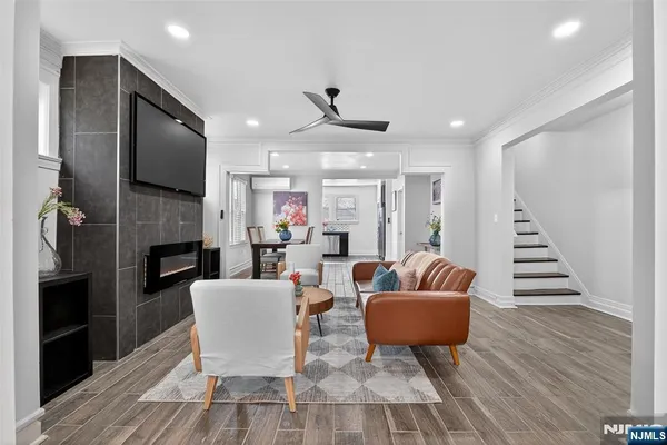 a living room with furniture and a fireplace